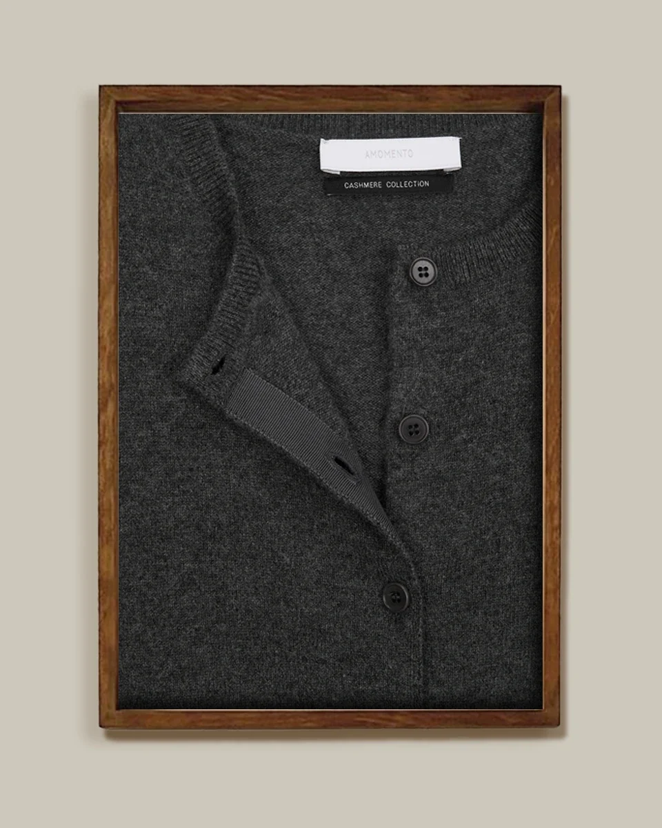 Charcoal cashmere cardigan in a wooden shadow-box frame