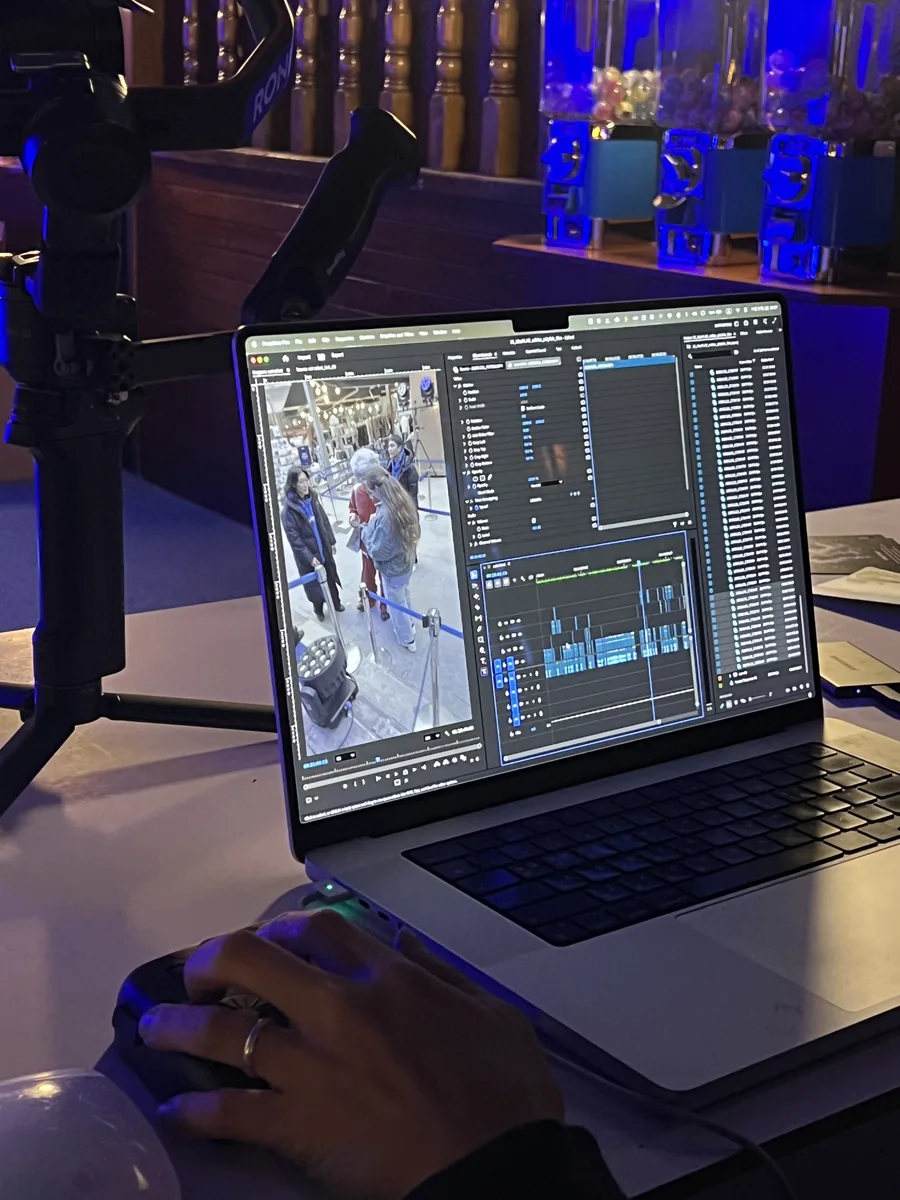 Editing footage on a laptop on site