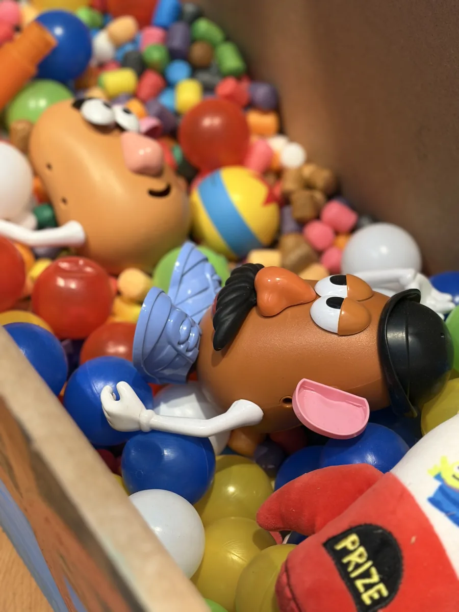 Ball pit of toys with Mr. Potato Head