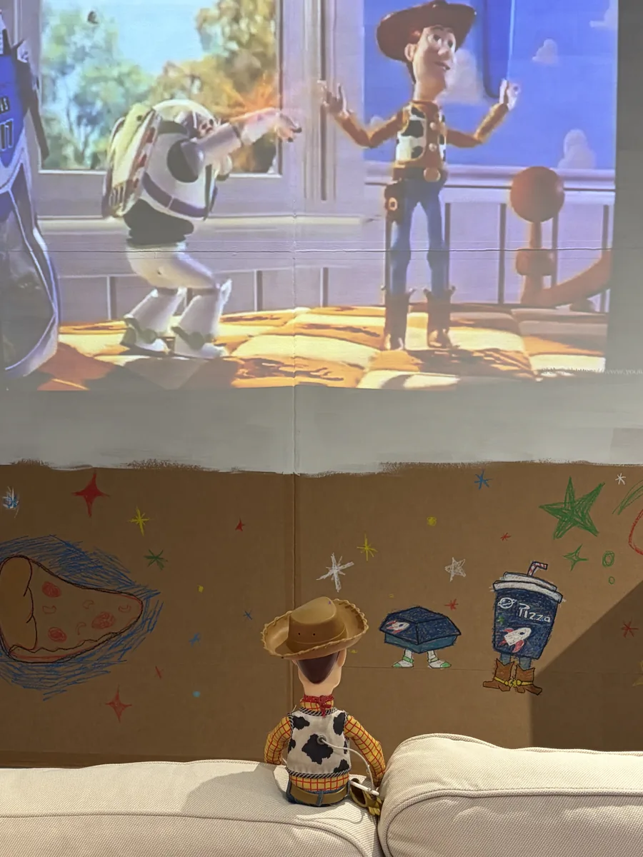 Buzz and Woody projected on the wall